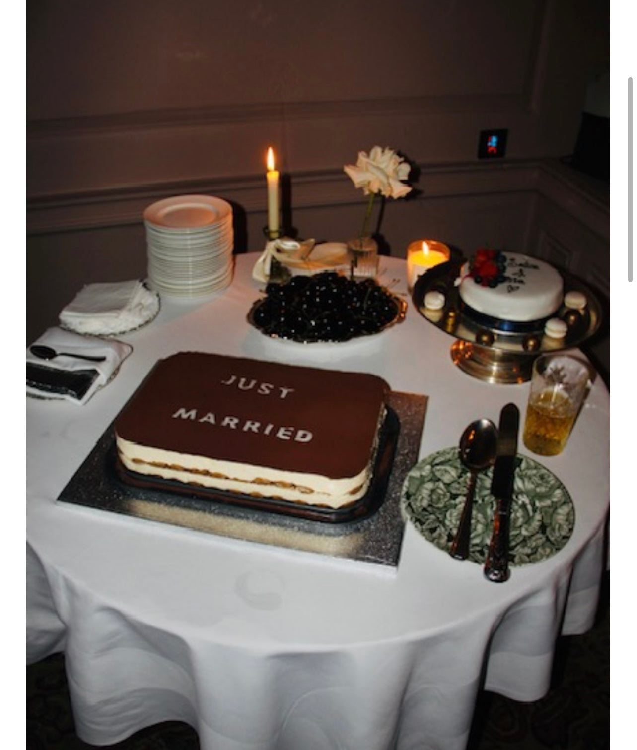 order 'Just Married'  tiramisu cake and other items on a white tablecloth.