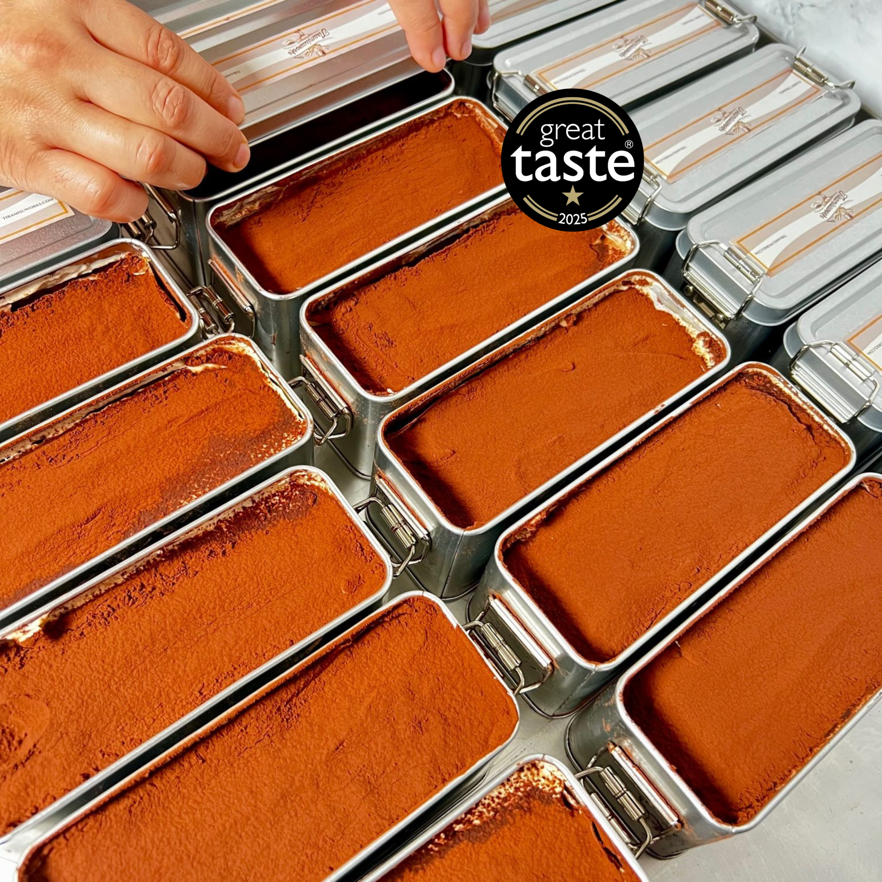 Award-winning tiramisu in metal tins with Great Taste logo – handcrafted, halal, and alcohol-free