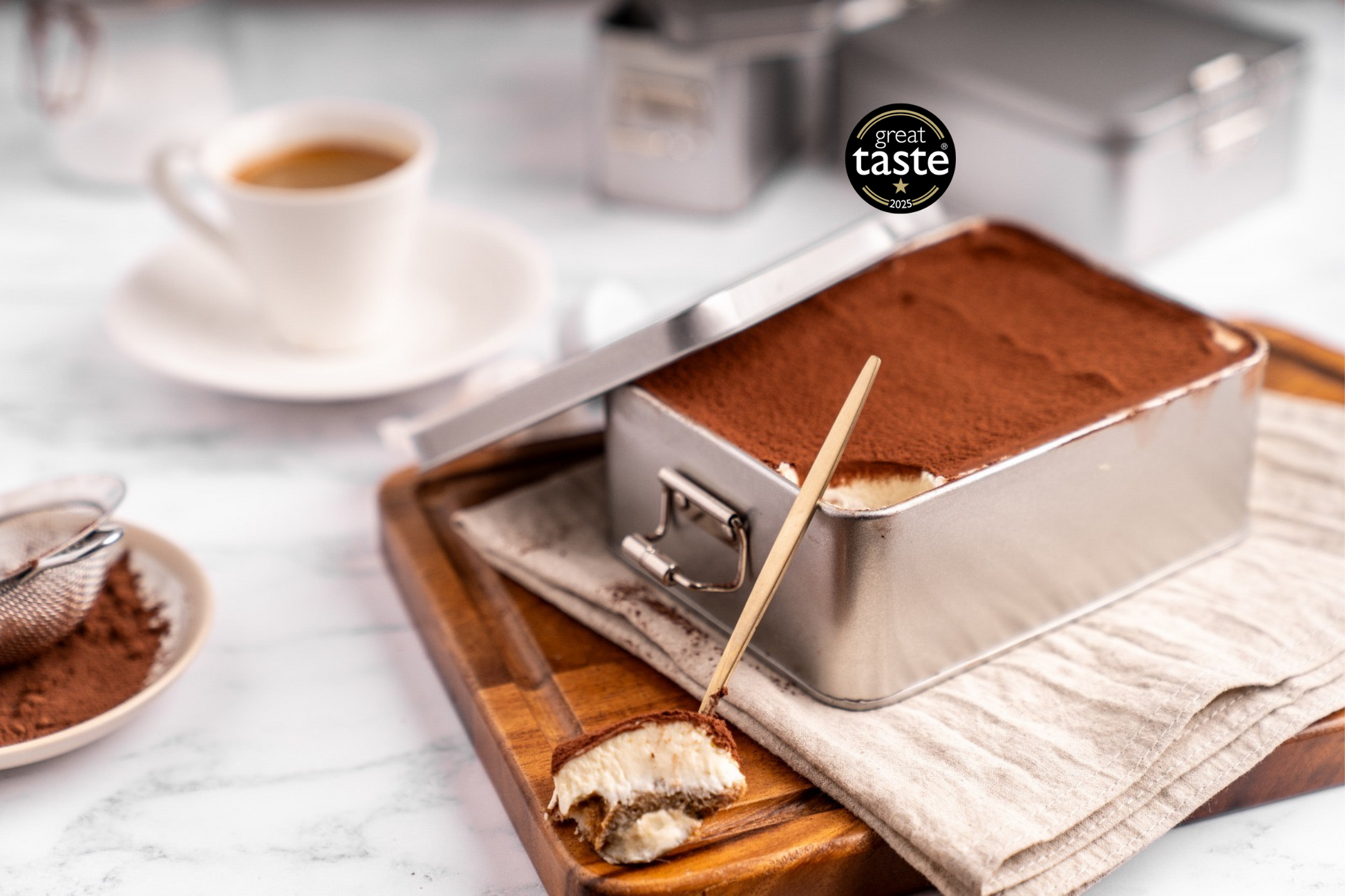 Classic Tiramisu 500g in eco-friendly packaging, creamy dessert served chilled, perfect for sharing.