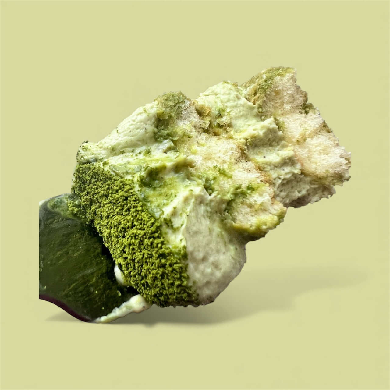 Close-up of Pistachio Matcha Tiramisu slice showcasing creamy texture and vibrant green matcha layers.