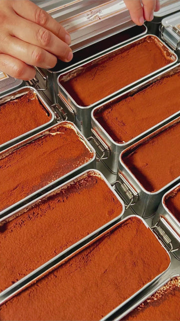 Watch our handmade tiramisu come to life – layered with fresh mascarpone, espresso-soaked sponge, and love – available for next-day delivery across the UK.